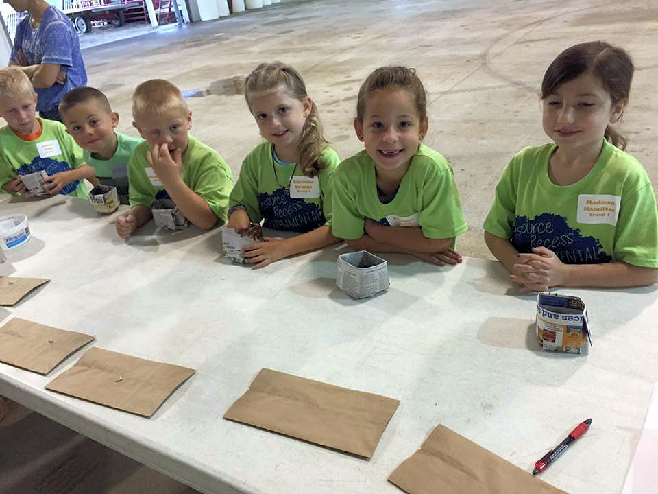6 children behind a table